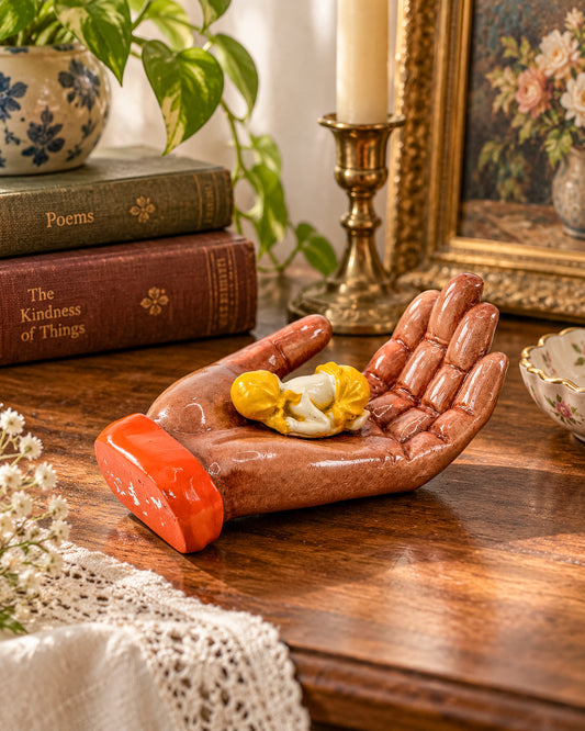 Ceramic Hand Sculpture with Sleeping Figure and Orange Cuff - Possibly Religious