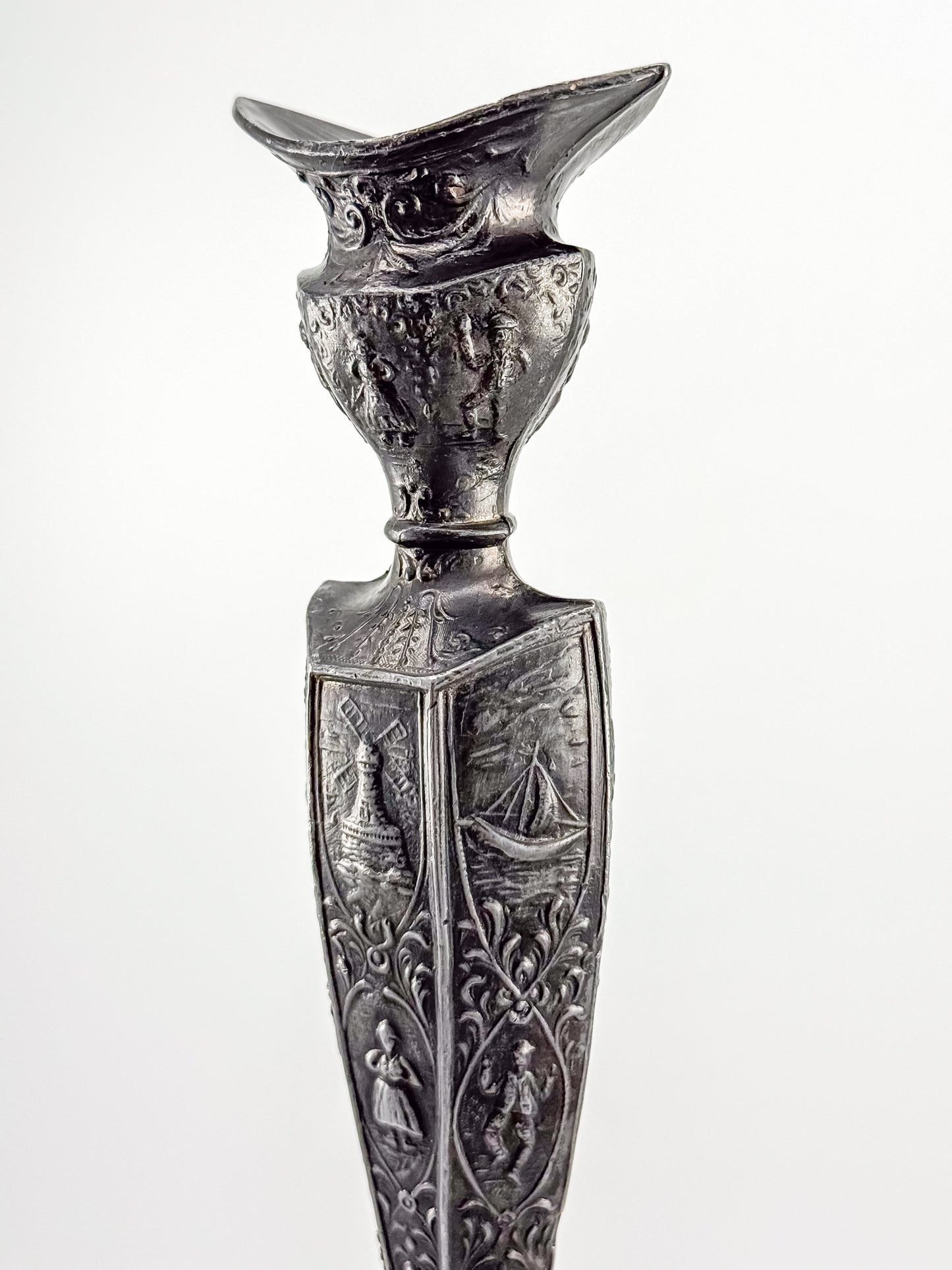 Antique Dutch Storyteller Candlestick with Figural Relief Panels and Fine Dutch Finish, Early 1900s