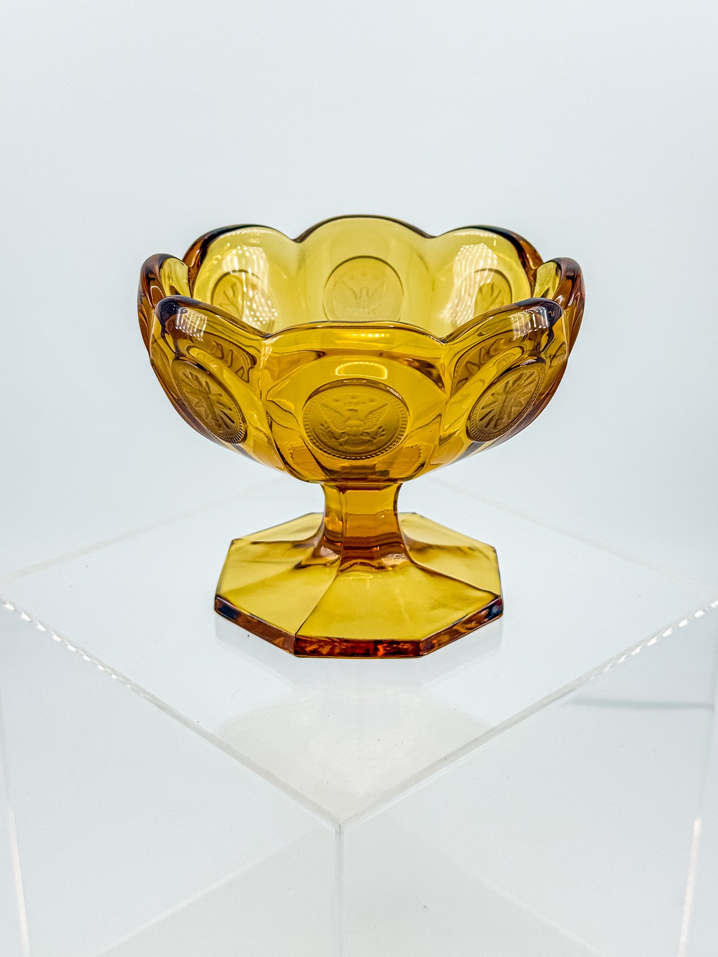 Fostoria Coin Glass Amber Pedestal Compote Candy Dish with Eagle Coin Motifs and Scalloped Rim