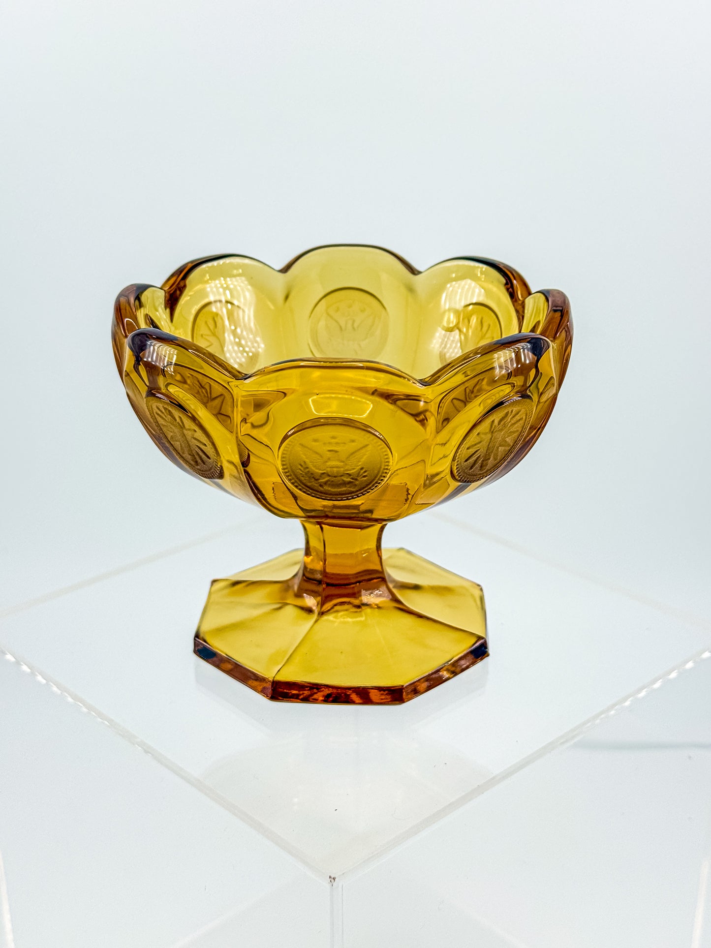 Fostoria Coin Glass Amber Pedestal Compote Candy Dish with Eagle Coin Motifs and Scalloped Rim