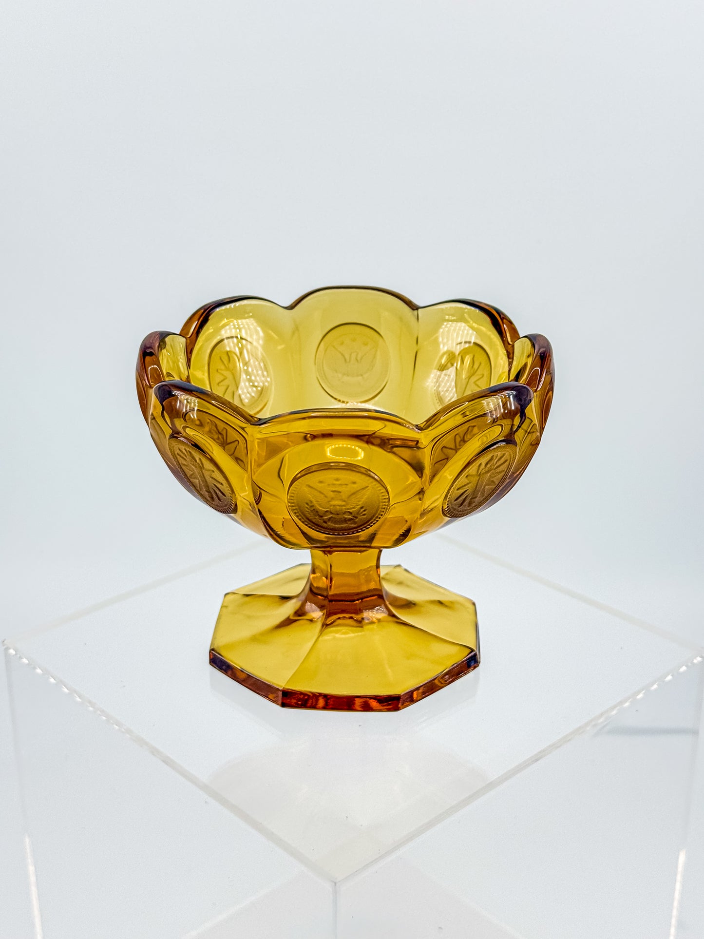 Fostoria Coin Glass Amber Pedestal Compote Candy Dish with Eagle Coin Motifs and Scalloped Rim