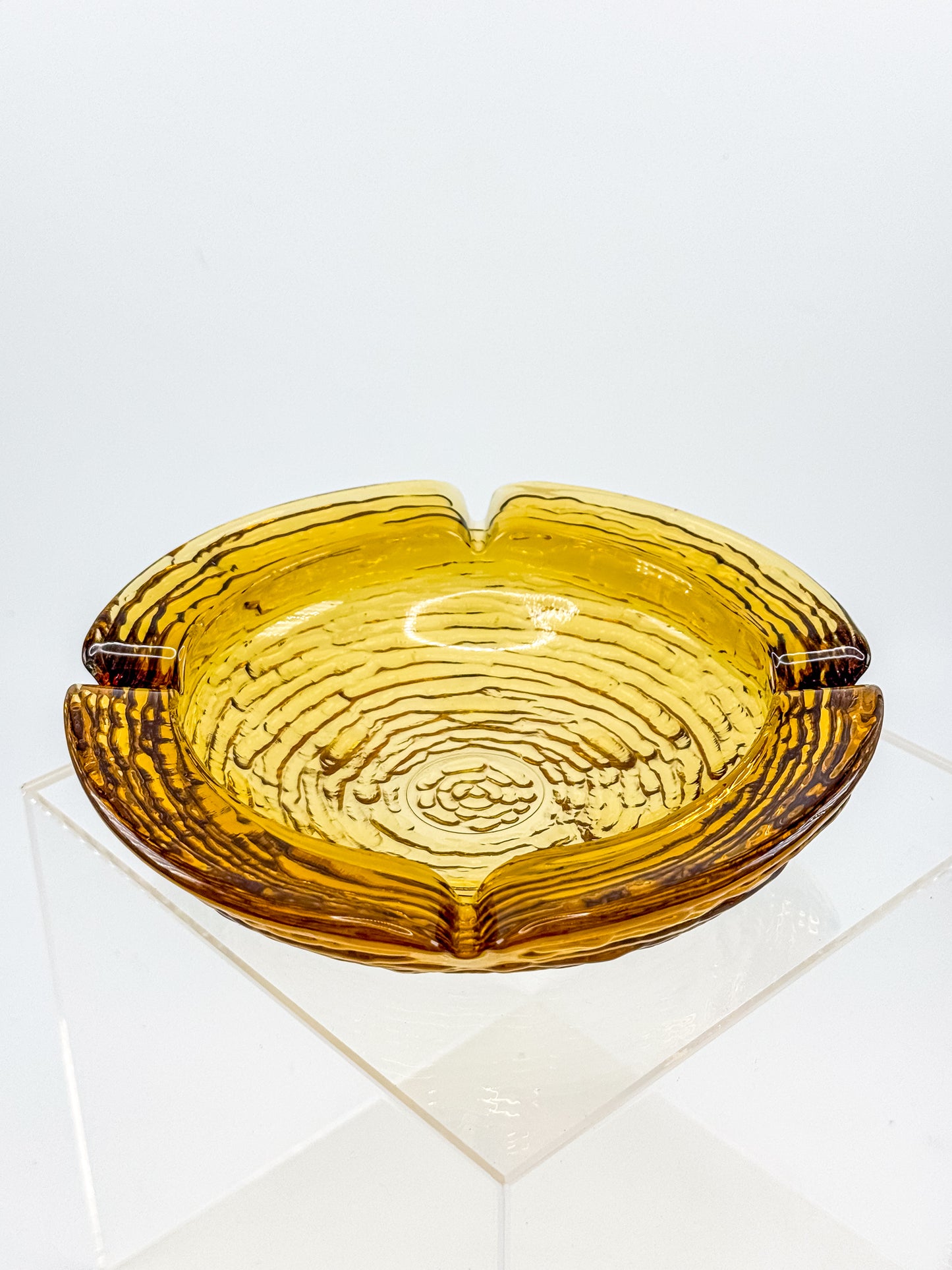 Vintage Anchor Hocking Soreno Amber Glass Ashtray with Concentric Bark Texture and Four Cigarette Rests