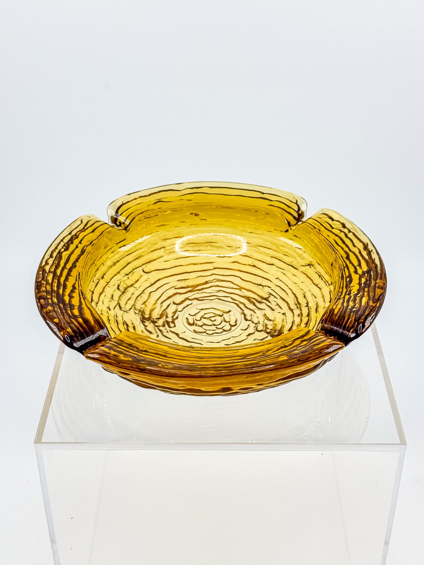 Vintage Anchor Hocking Soreno Amber Glass Ashtray with Concentric Bark Texture and Four Cigarette Rests