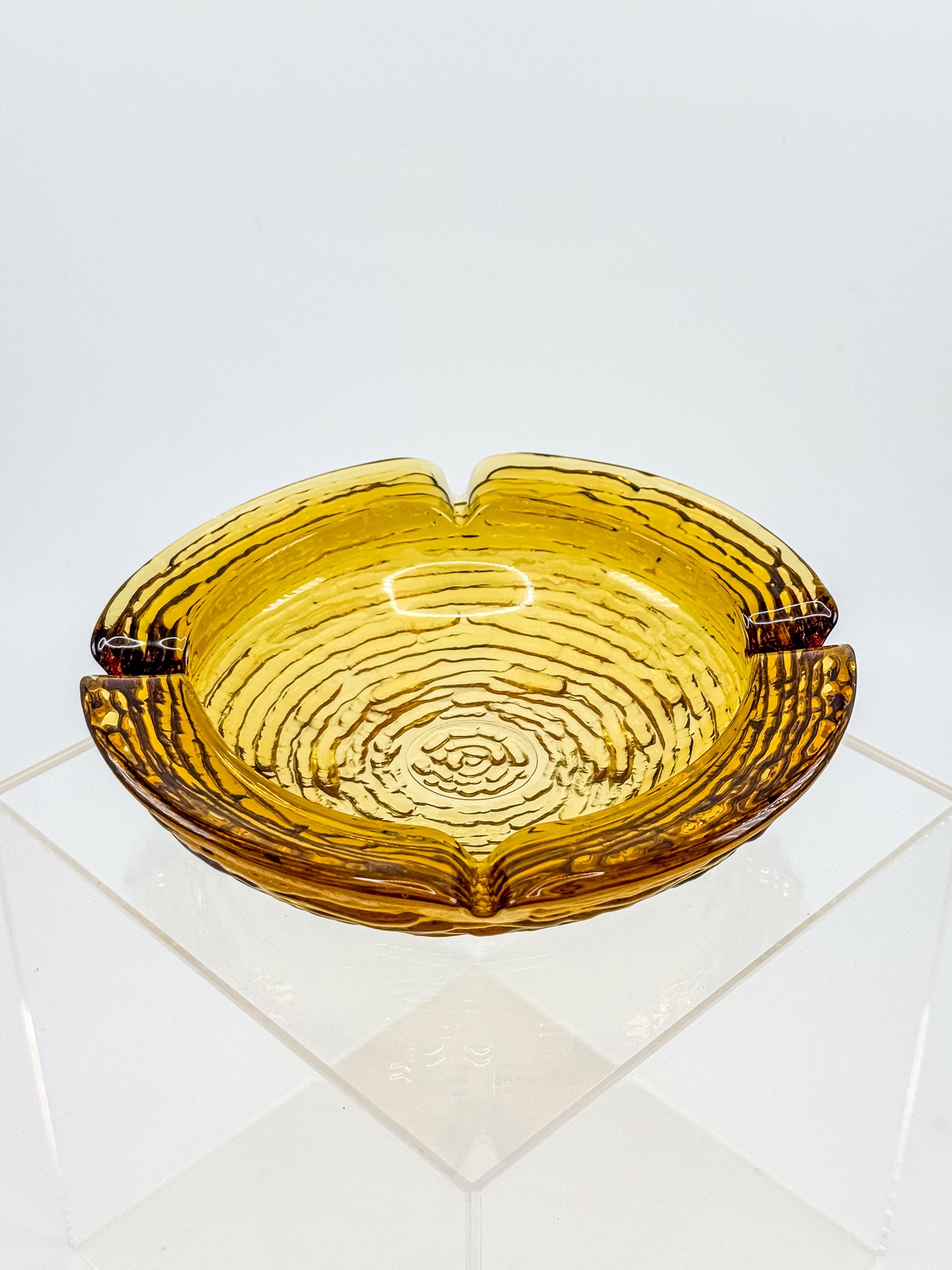 Vintage Anchor Hocking Soreno Amber Glass Ashtray with Concentric Bark Texture and Four Cigarette Rests