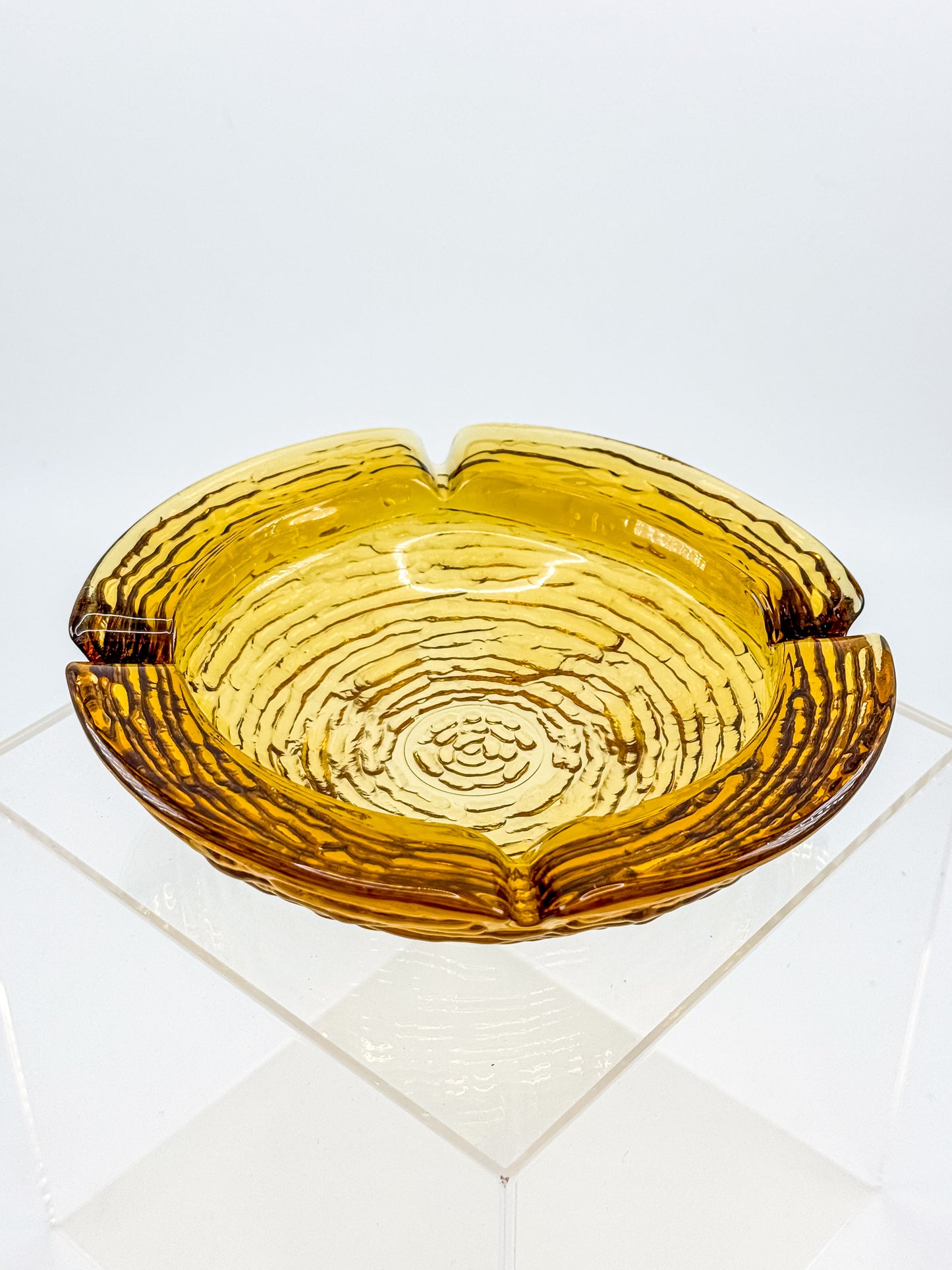 Vintage Anchor Hocking Soreno Amber Glass Ashtray with Concentric Bark Texture and Four Cigarette Rests