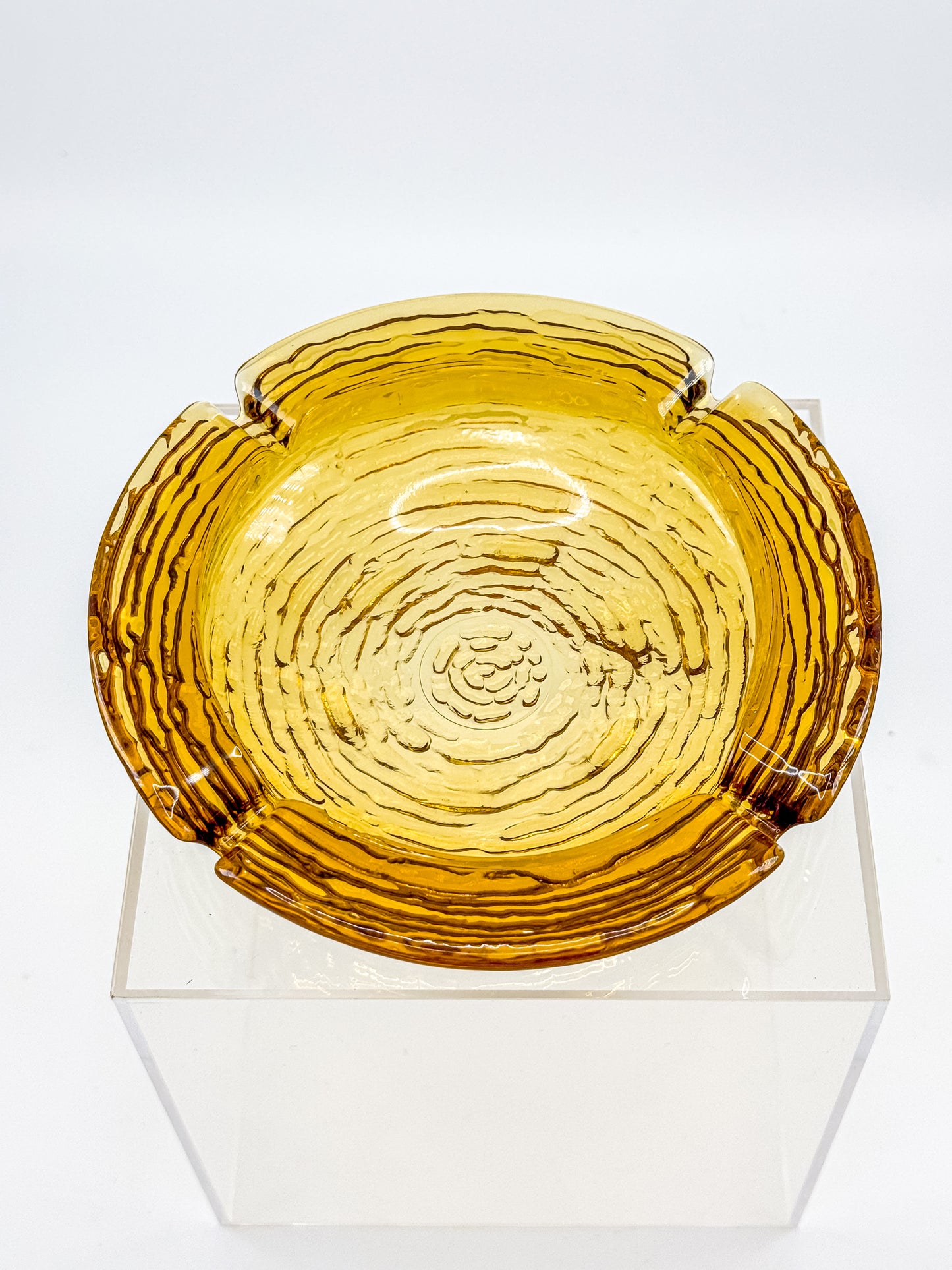 Vintage Anchor Hocking Soreno Amber Glass Ashtray with Concentric Bark Texture and Four Cigarette Rests