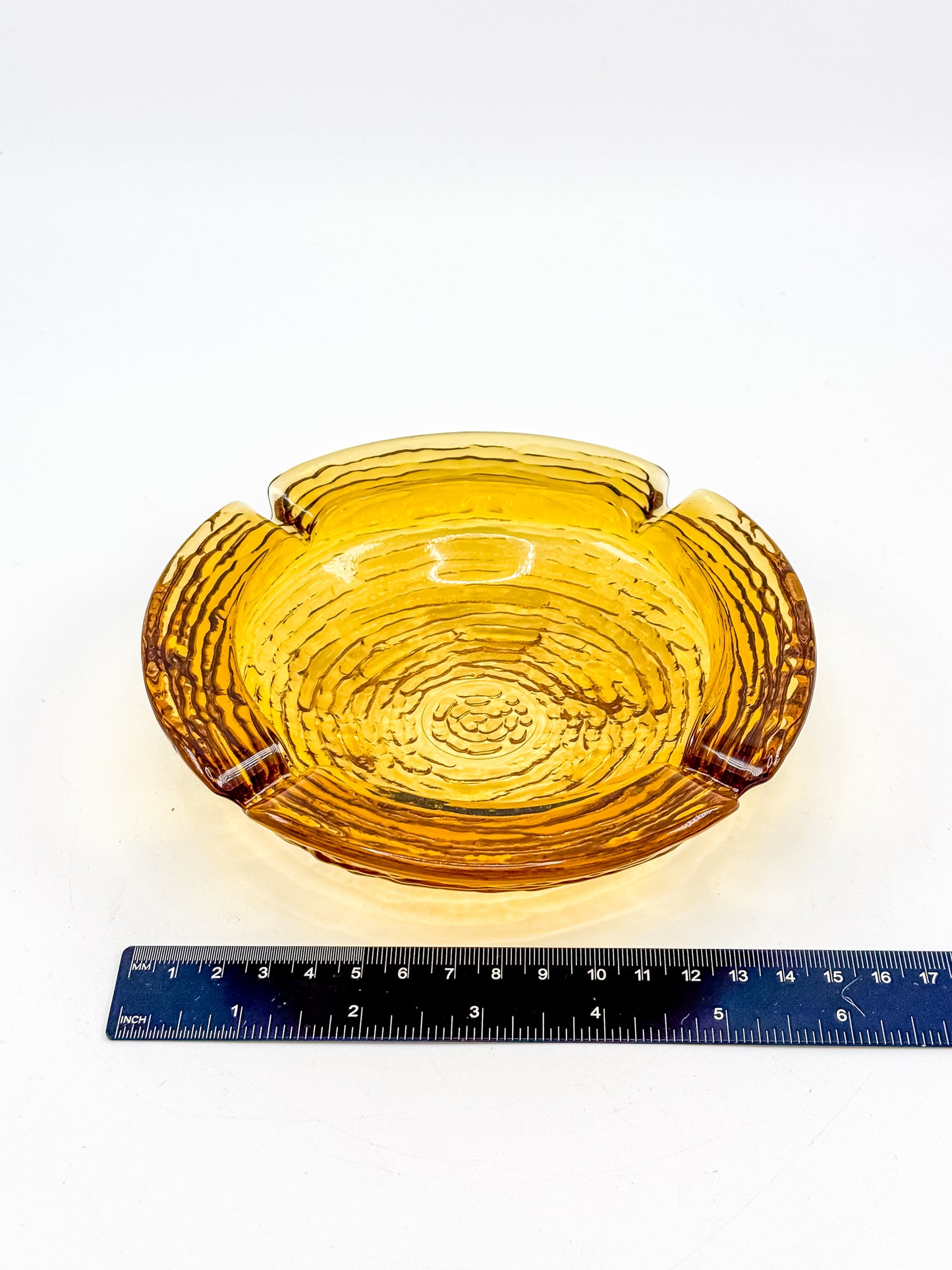 Vintage Anchor Hocking Soreno Amber Glass Ashtray with Concentric Bark Texture and Four Cigarette Rests