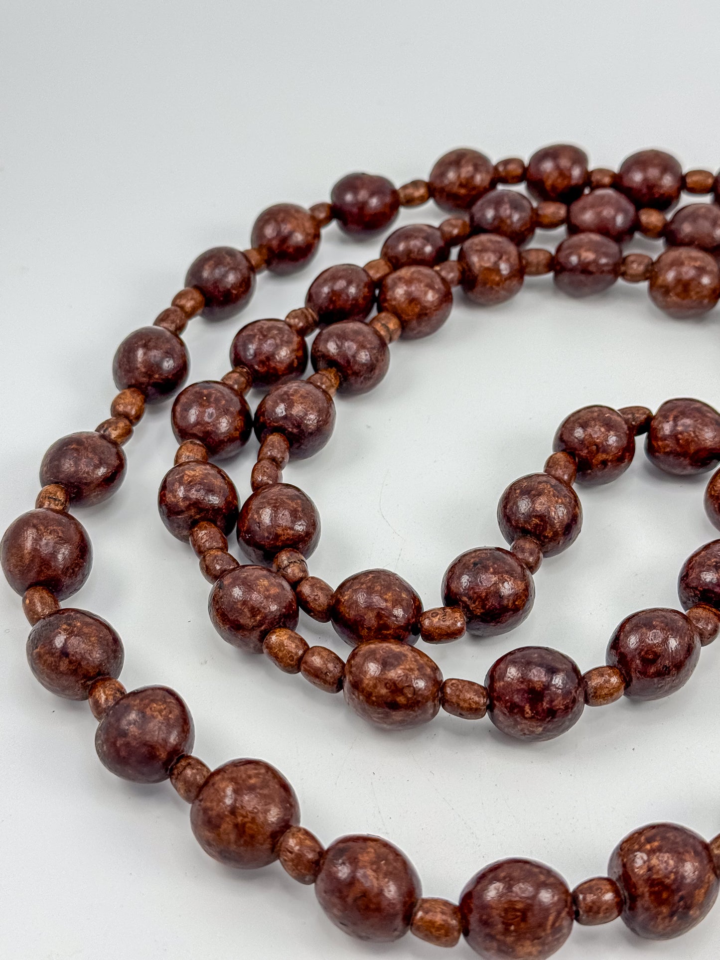 Vintage monastic rosary laid flat next to ruler confirming approximately 40 inches in length