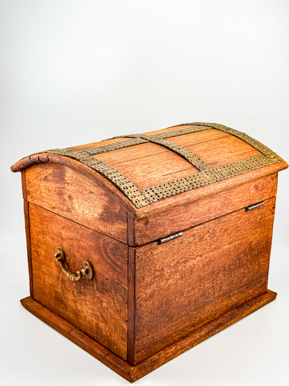 Interior view of vintage Indian brass-inlay wooden treasure chest showing raw wood and silver hinges