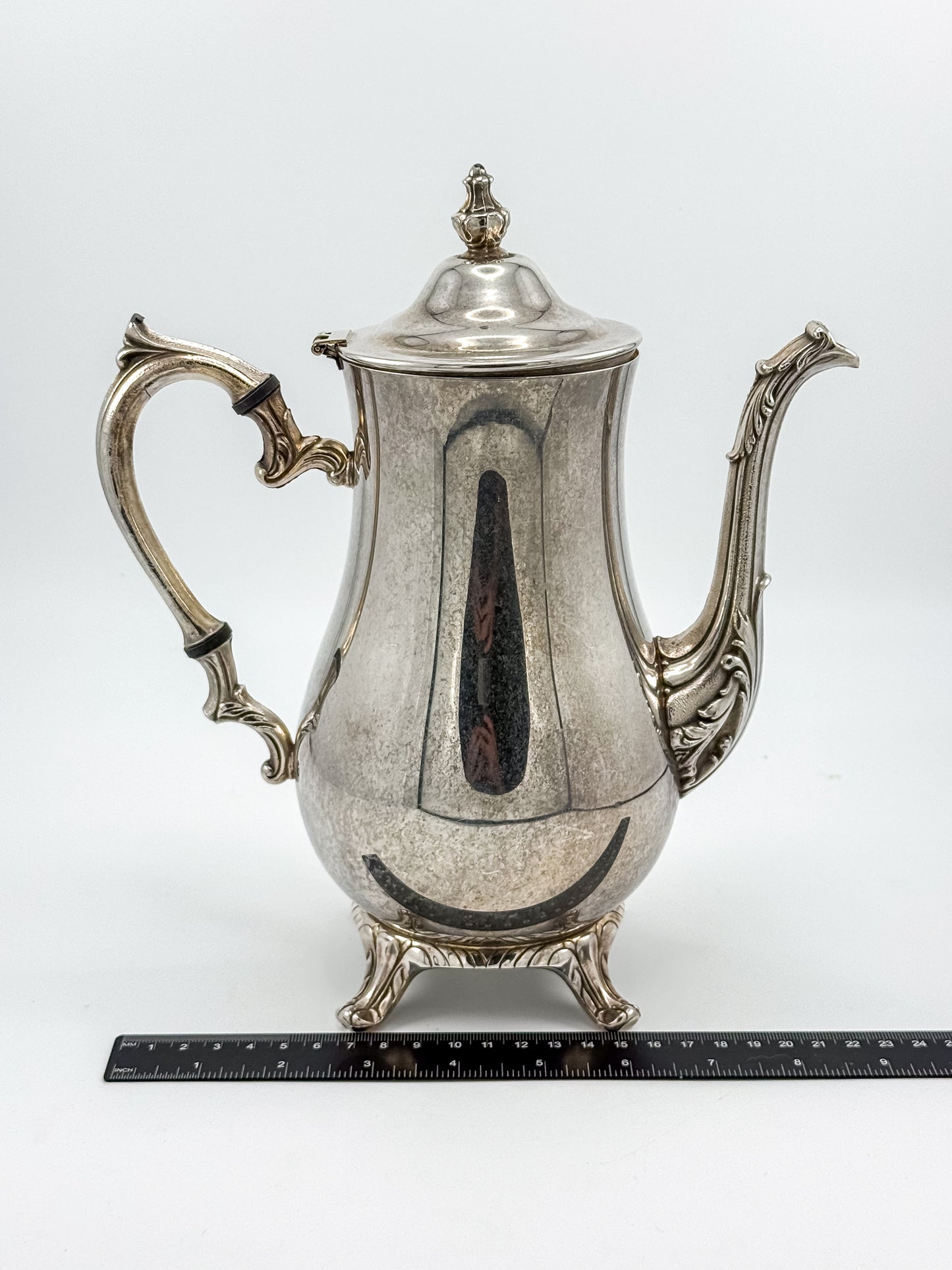 Vintage International Silver Co. Ornate Silver-Plate Teapot with Hinged Lid and Scroll Feet