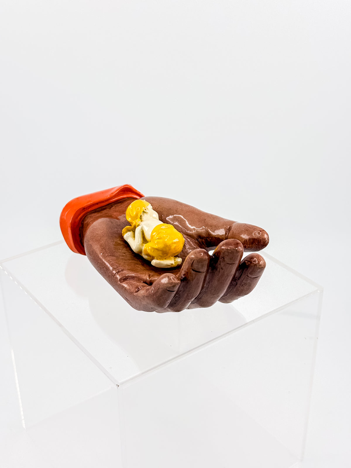 Ceramic Hand Sculpture with Sleeping Figure and Orange Cuff - Possibly Religious