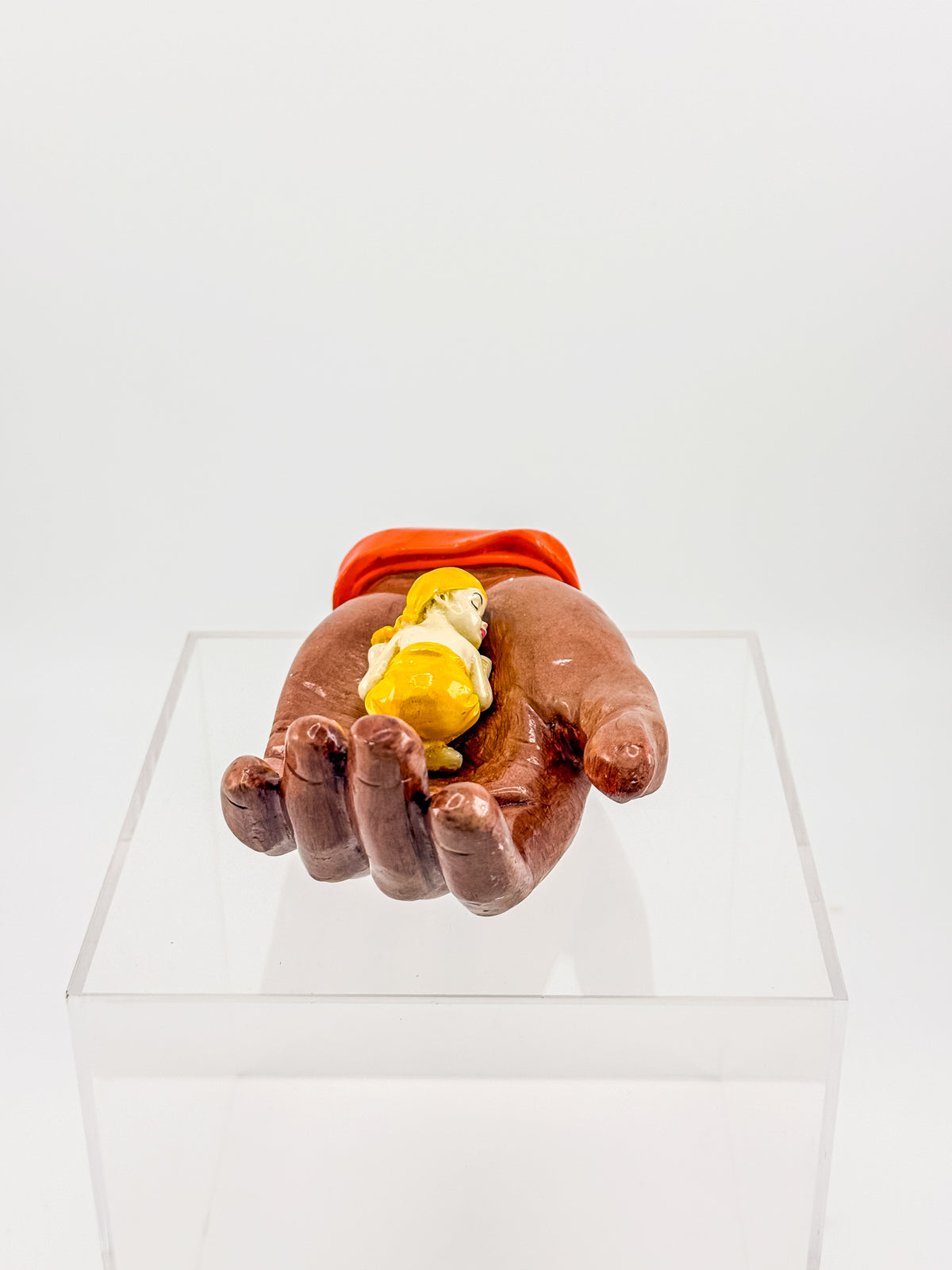 Ceramic Hand Sculpture with Sleeping Figure and Orange Cuff - Possibly Religious