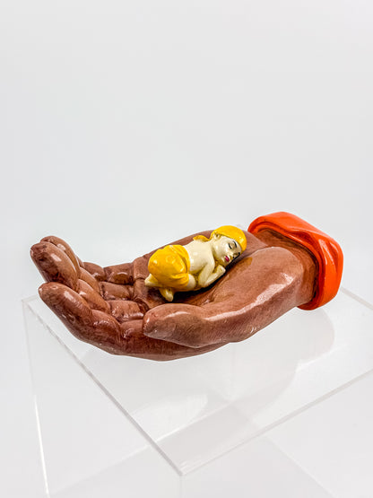 Ceramic Hand Sculpture with Sleeping Figure and Orange Cuff - Possibly Religious