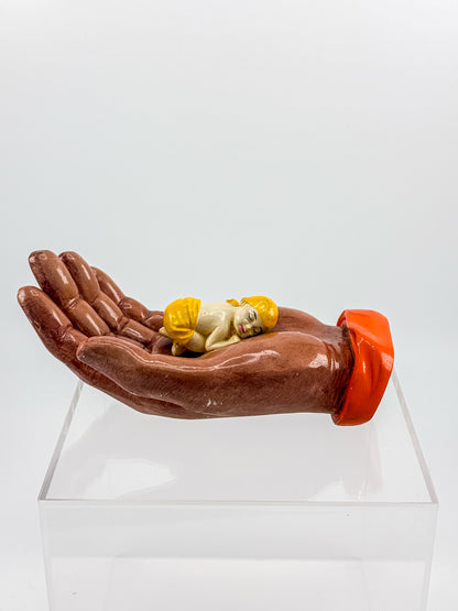 Ceramic Hand Sculpture with Sleeping Figure and Orange Cuff - Possibly Religious