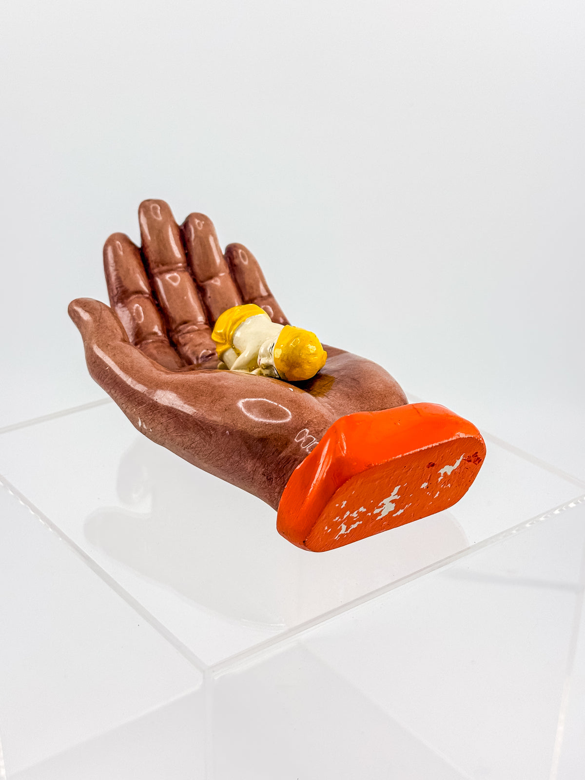 Ceramic Hand Sculpture with Sleeping Figure and Orange Cuff - Possibly Religious