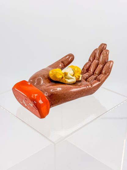 Ceramic Hand Sculpture with Sleeping Figure and Orange Cuff - Possibly Religious