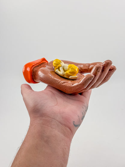 Ceramic Hand Sculpture with Sleeping Figure and Orange Cuff - Possibly Religious