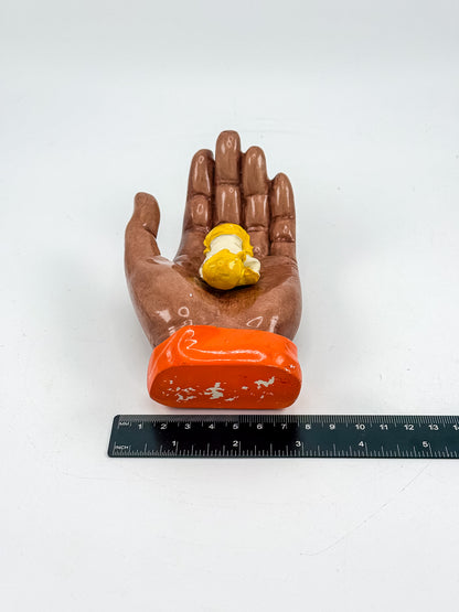 Ceramic Hand Sculpture with Sleeping Figure and Orange Cuff - Possibly Religious