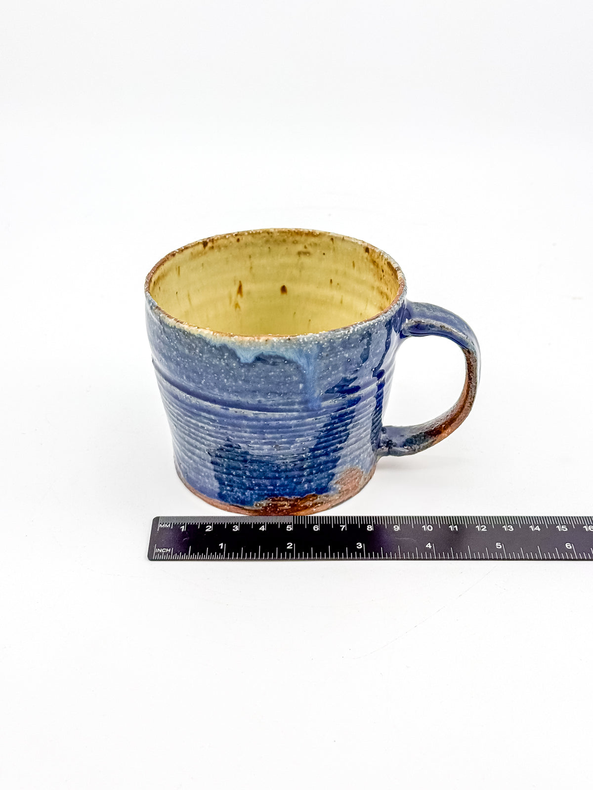 Handmade Blue Studio Pottery Mug with Mustard Yellow Interior