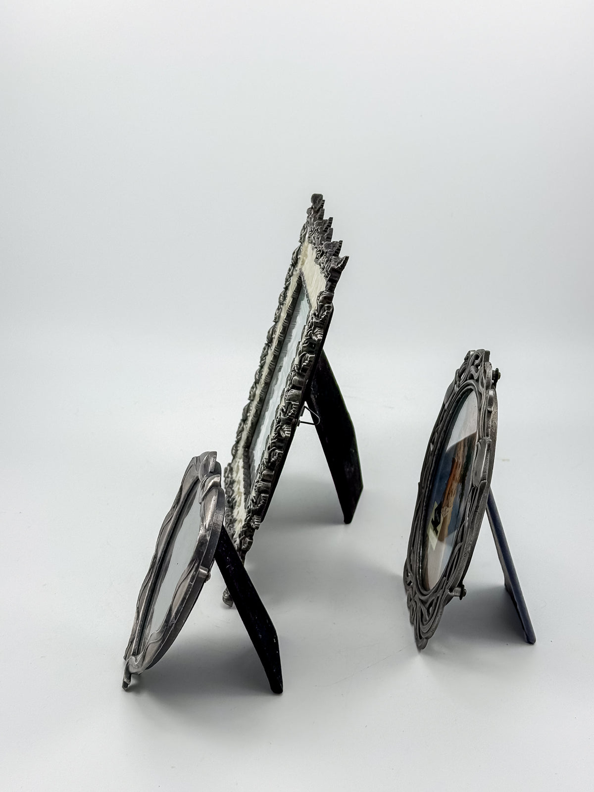 Ornate Pewter and Enamel Picture Frame with Two Silver-Tone Frames, Set of Three