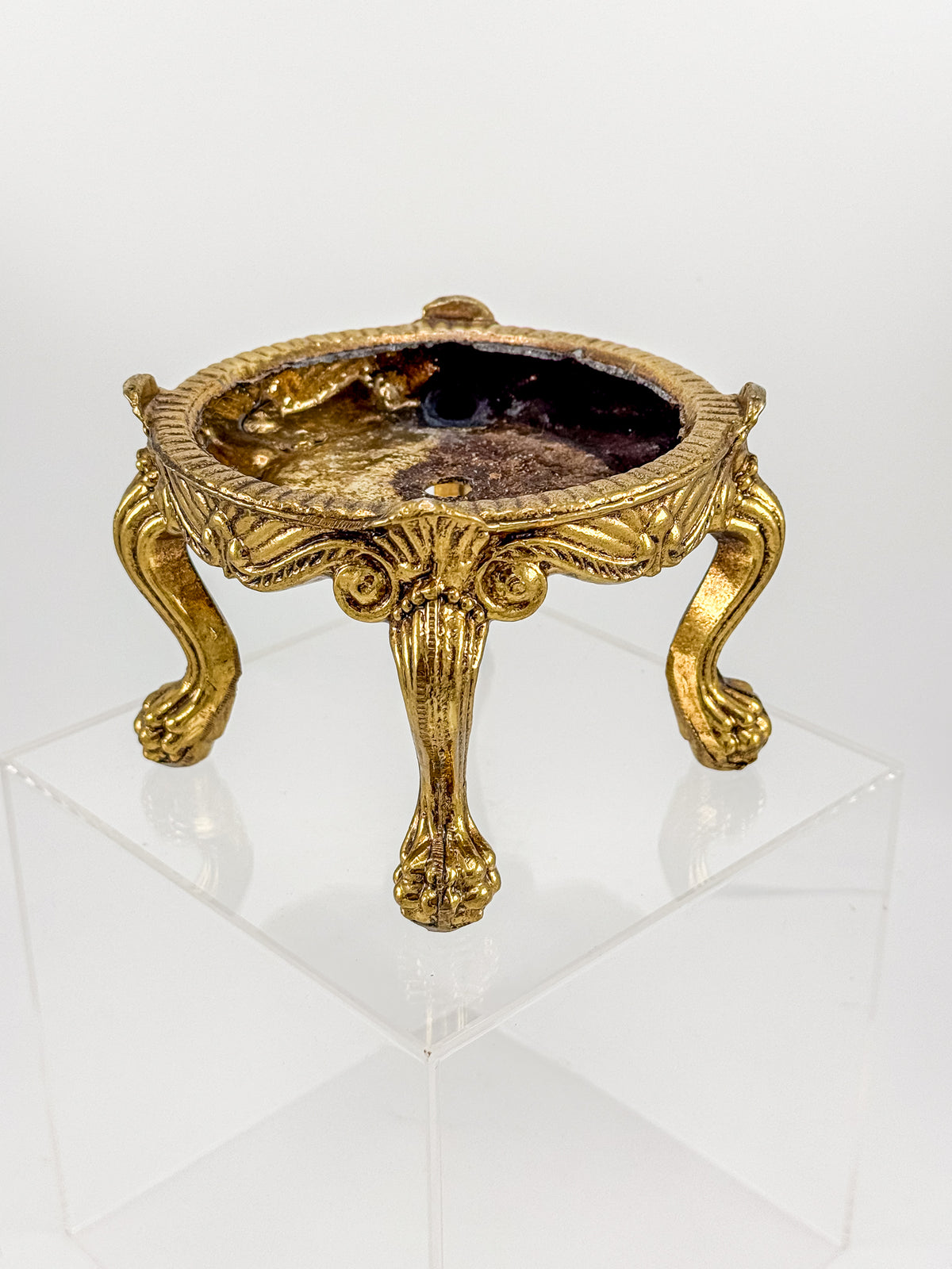 Vintage Ornate Gold-Tone Metal Display Base with Four Claw Feet and Rococo-Style Scrollwork