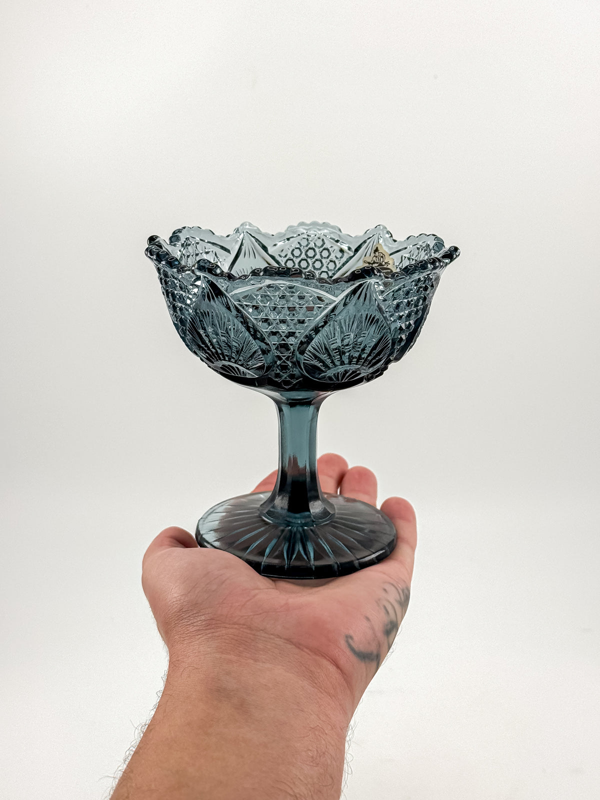 Vintage Fenton Regency Federal Blue Glass Footed Compote with Floral Panels and Scalloped Rim